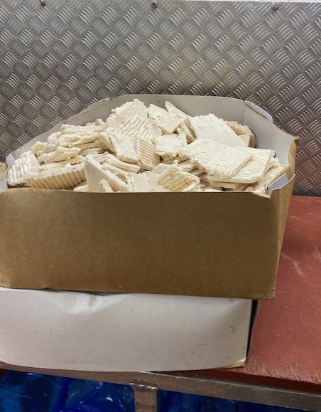 Frozen pressed codfat blocks in bulk packaging