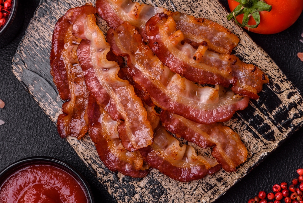 Smoked streaky bacon rashers cooked.